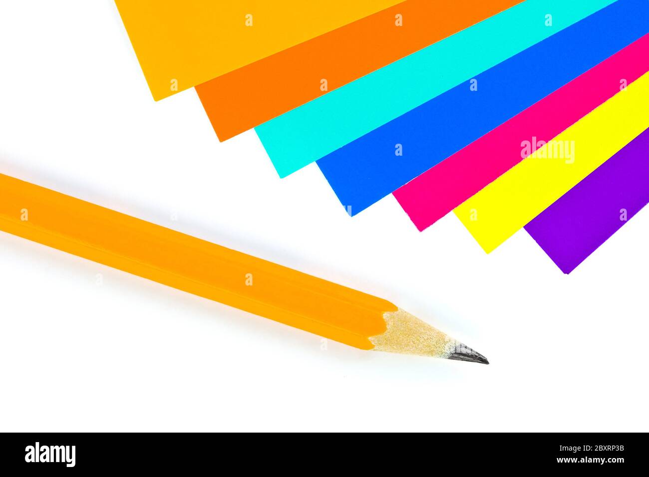 Multicolored paper and pencil Stock Photo