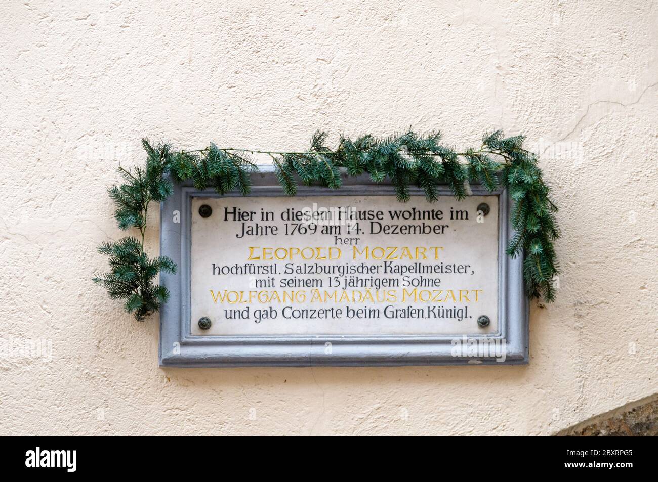 INNSBRUCK, AUSTRIA - MAY 11, 2013: The plaquette in the wall of the hotel Weisses Kreuz in Innsbruck Austria. According to the text the young Wolfgang Stock Photo