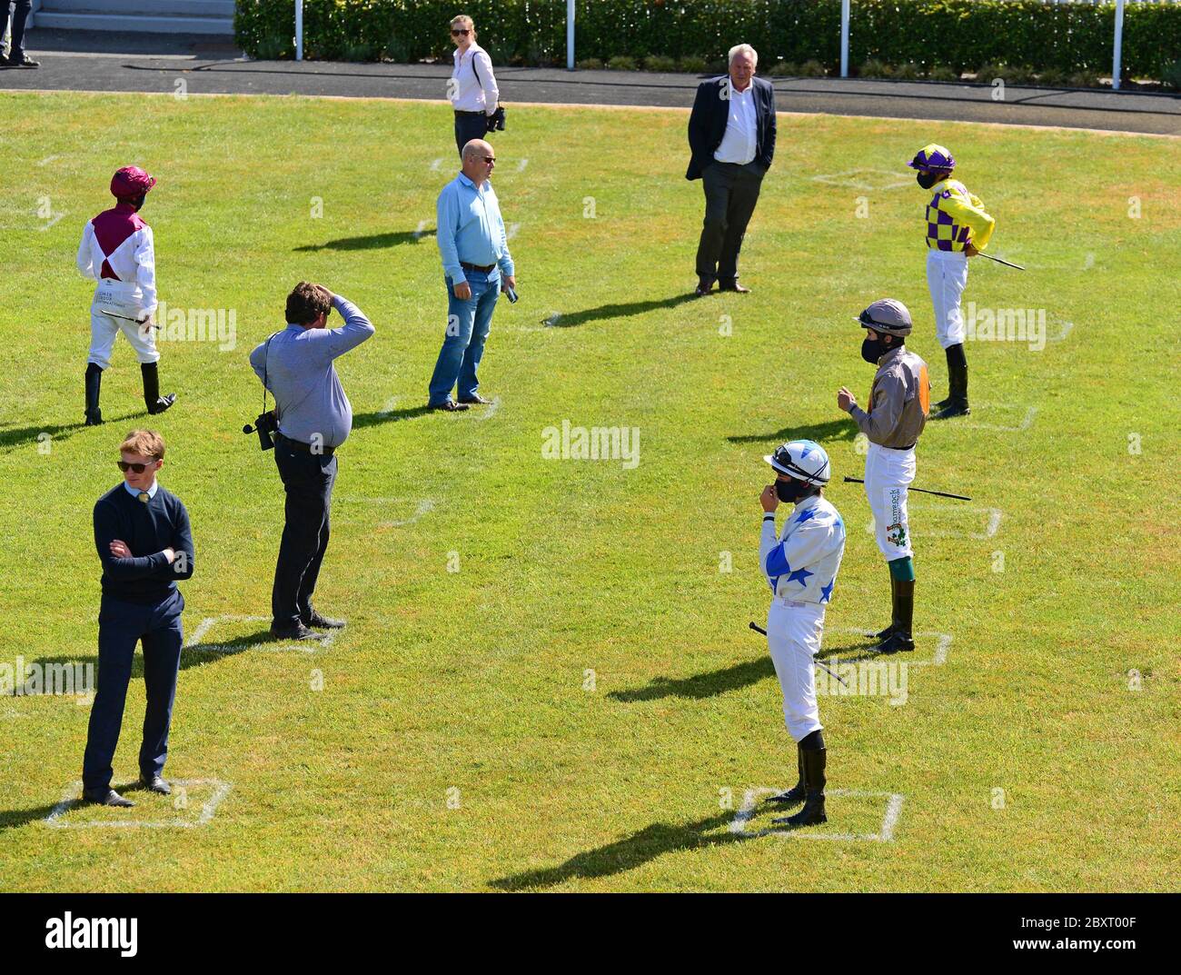 Social Distancing in the parade ring before the Clinton Higgins Chartered Accountants Handicap at Naas Racecourse, Co. Kildare, Ireland. Stock Photo