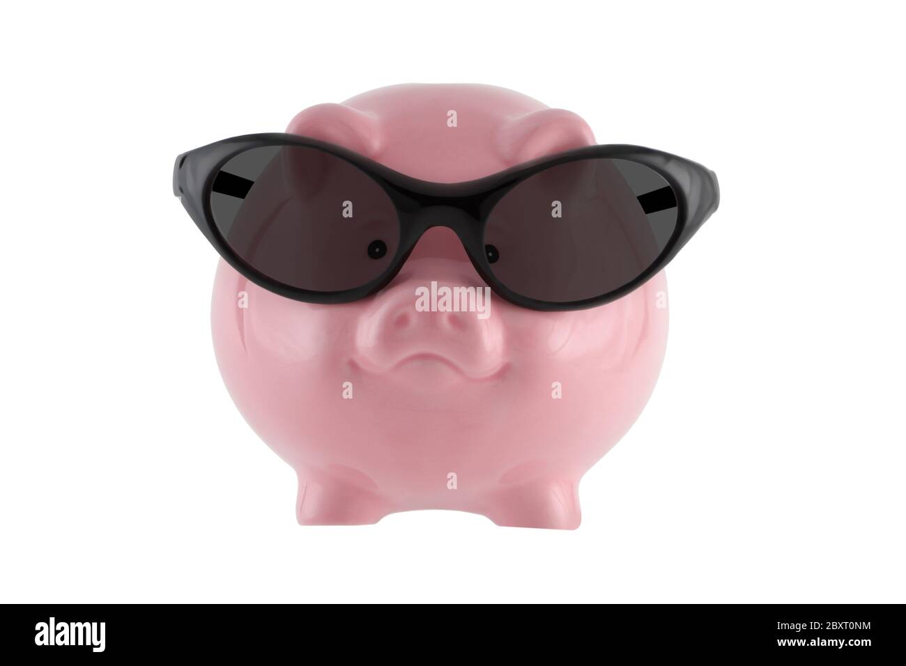 Saving for a sunny day. Pink piggy bank wearing sunglasses isolated on ...