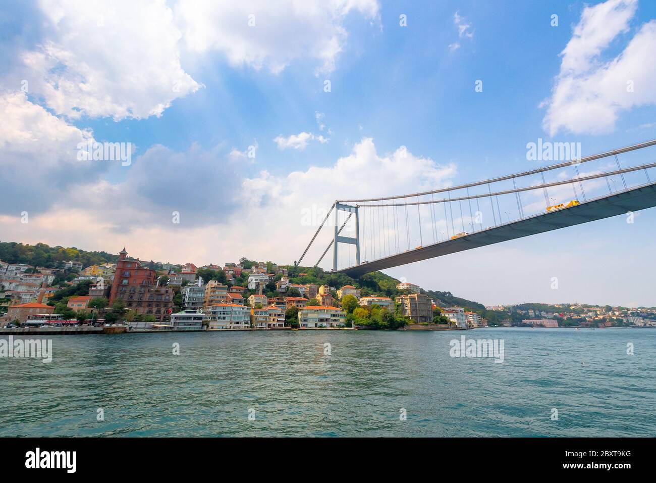 istanbul, turkey - AUG 18, 2015: fatih sultan mehmet bridge above the bosphorus. beautiful cityscape of historical area observed from the water on a s Stock Photo