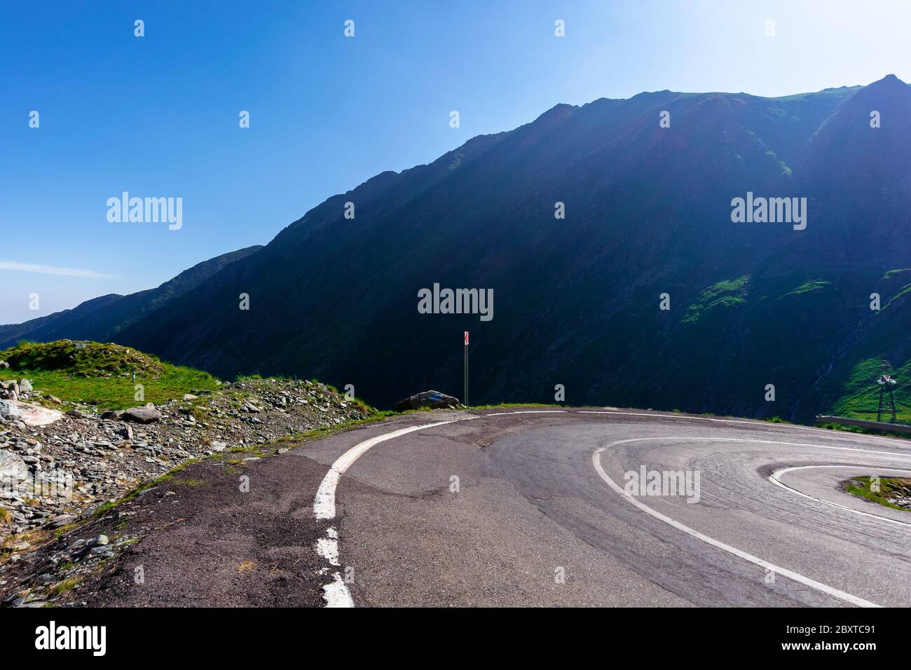 mountain road on a sunny morning. empty highway uphill through valley.  great european journey in summertime concept. Stock Photo
