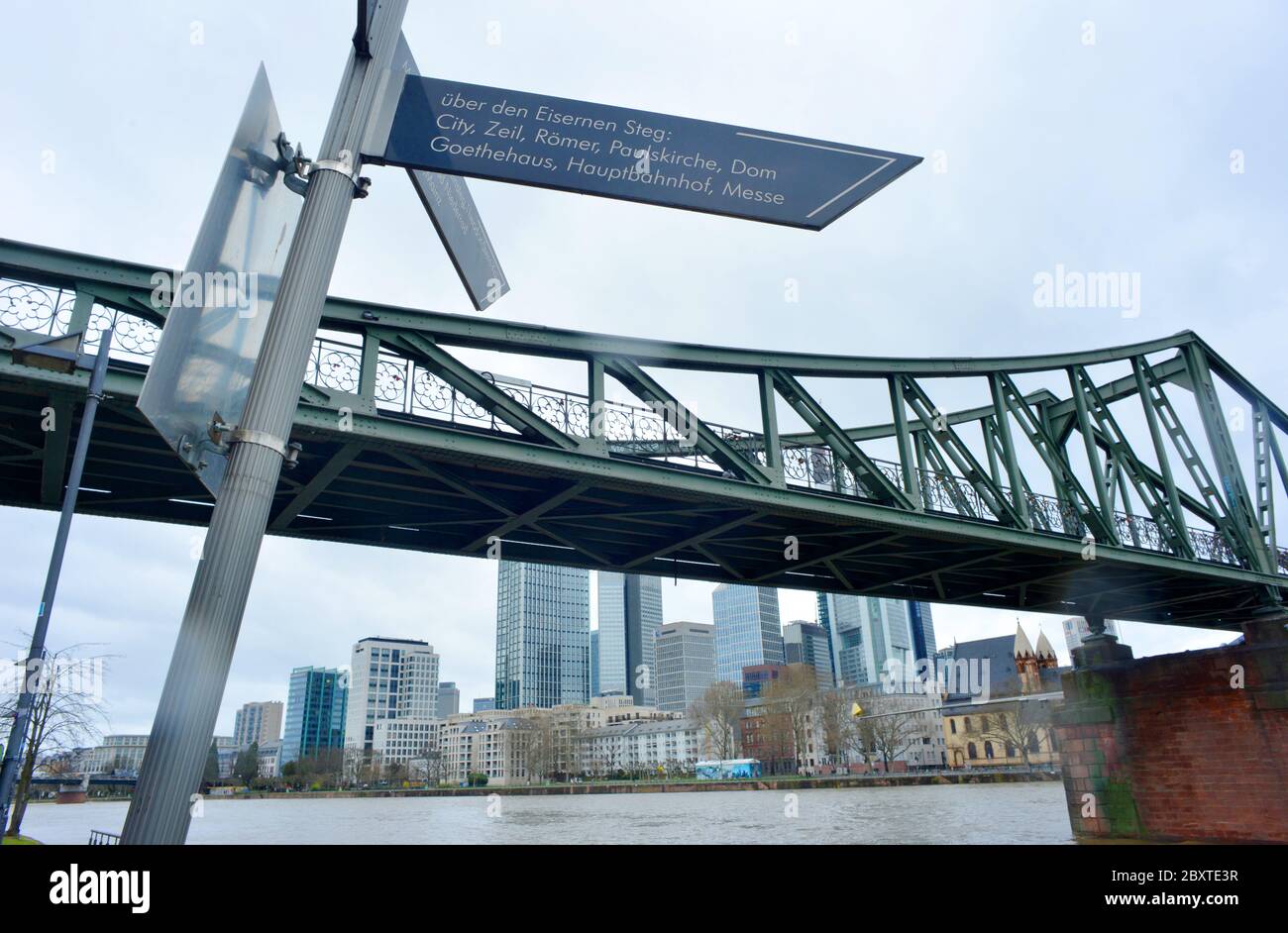 Frankfurt Main, Germany 03-11-2013 Eisener Steg bridge with a sign of touristical destinations of the town Stock Photo