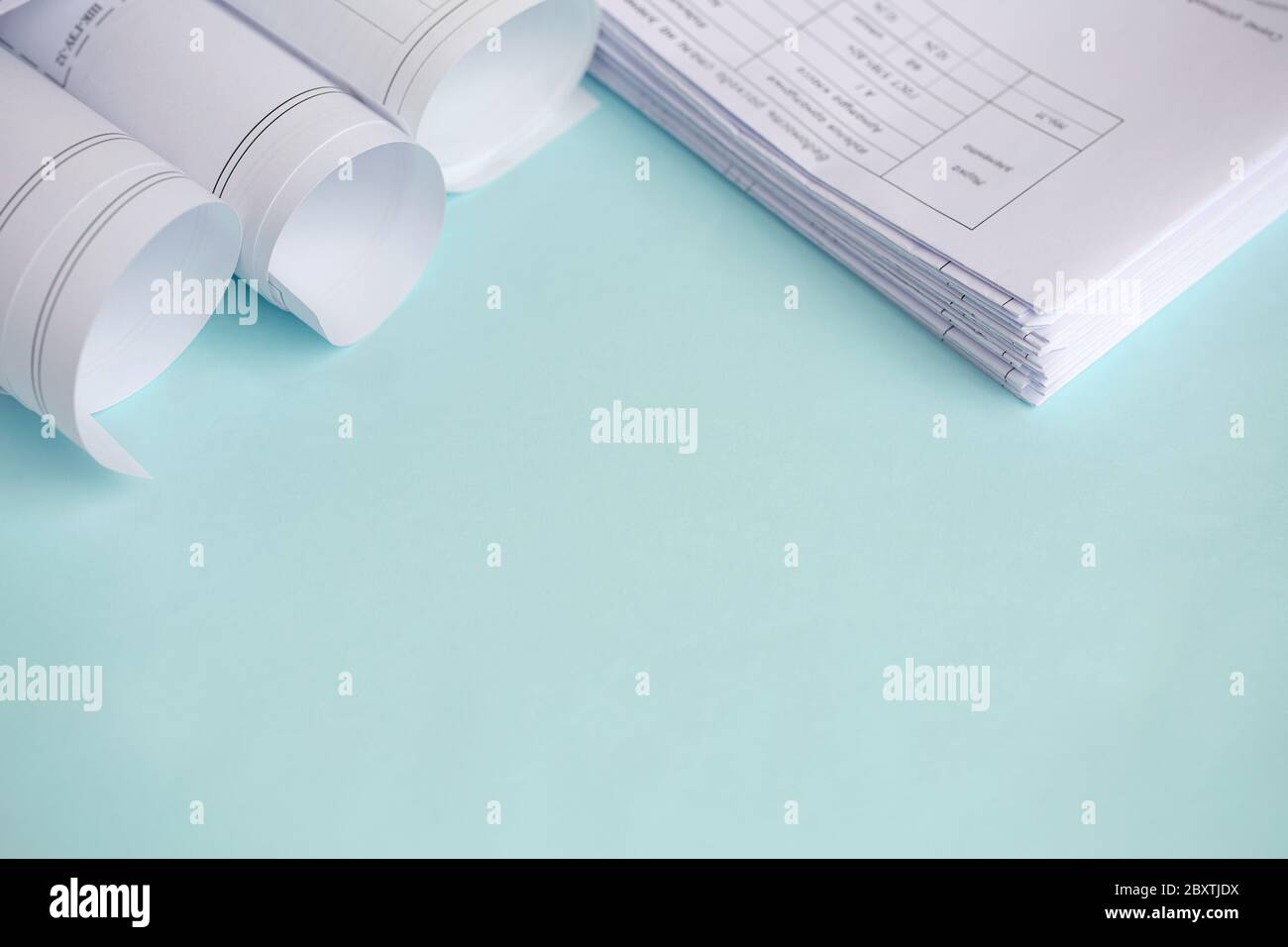 Stack Folding drawings on a blue background. Top view. Flat lay. Copy space Stock Photo