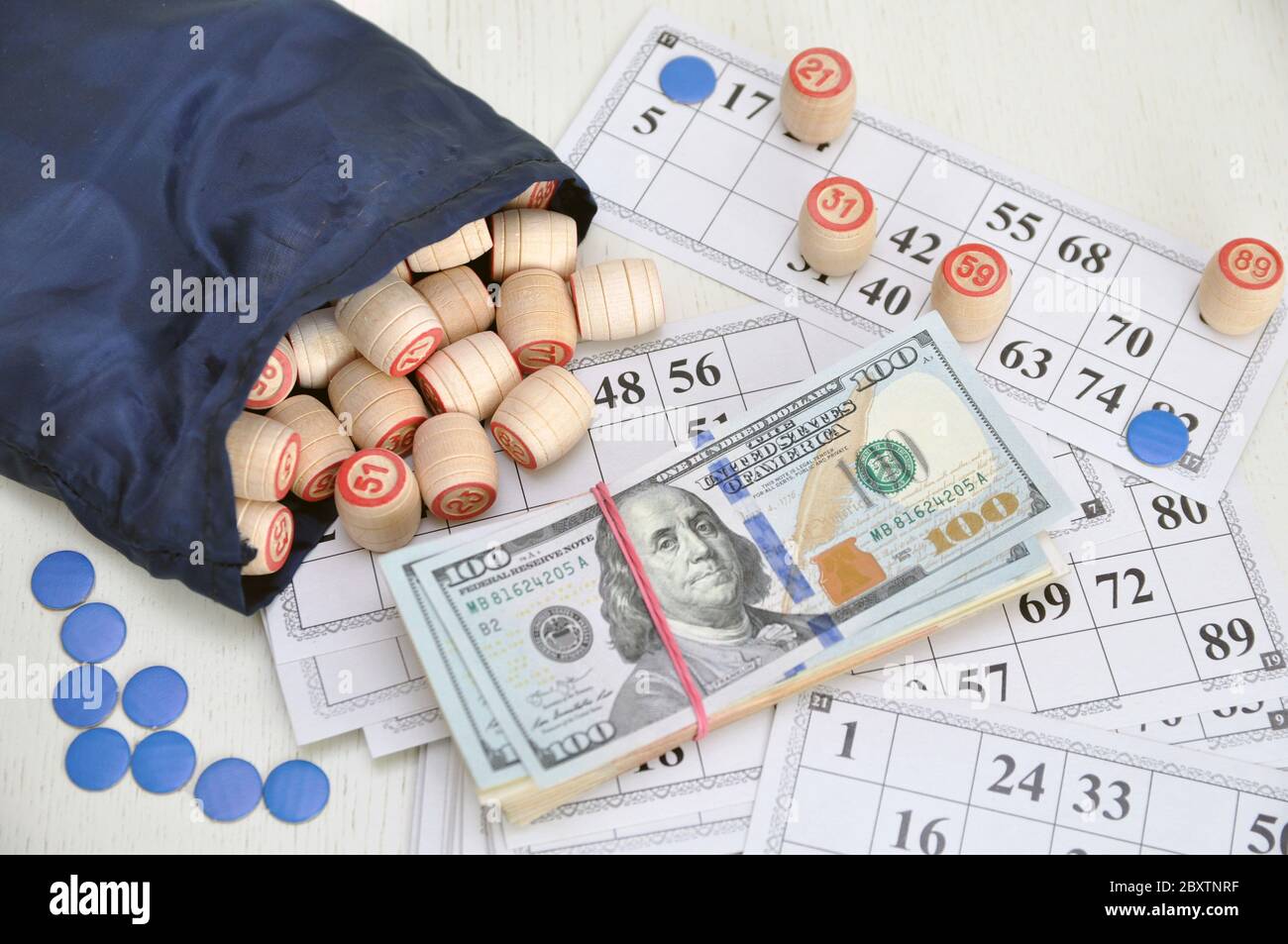 U.S. dollars. board game lotto. Wooden barrels on paper cards, a game for money. Excitement. Stock Photo