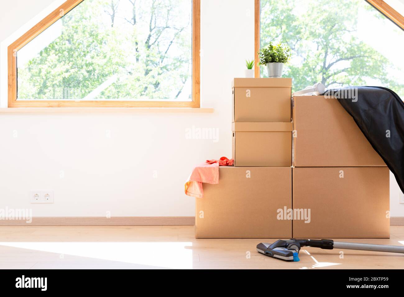 Move. Cardboard boxes for moving into a new, clean home. In a sunny day