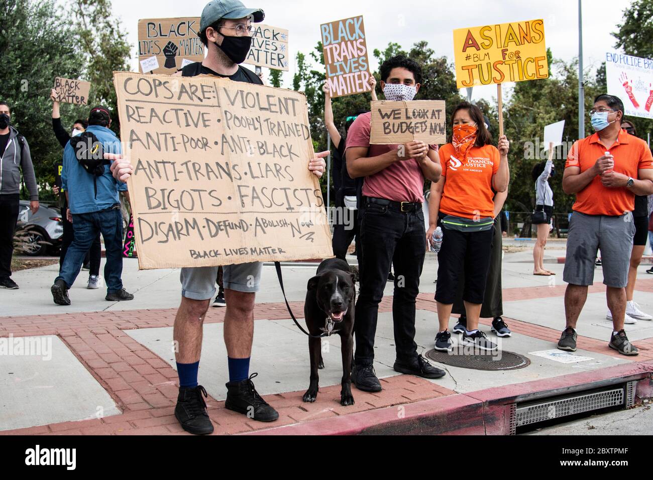 Protester with sign at demonstration honoring George Floyd, in the Highland Park neighborhood of Los Angeles, California Stock Photo