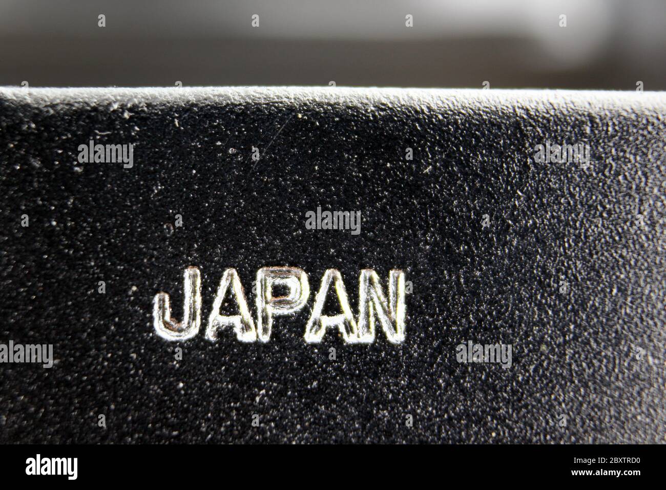 Japan engraved on metal surface, close-up Stock Photo