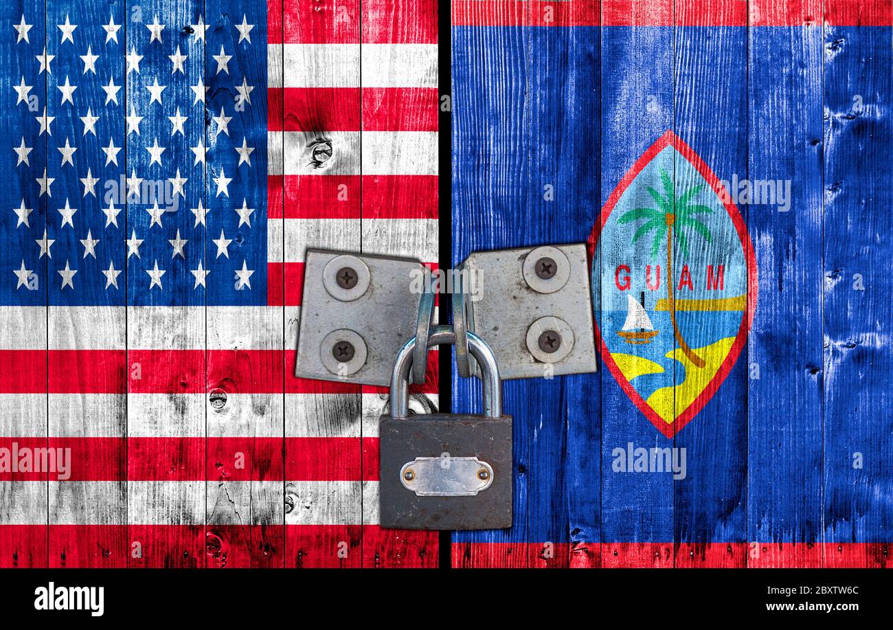 US and Guam flag on door with padlock Stock Photo