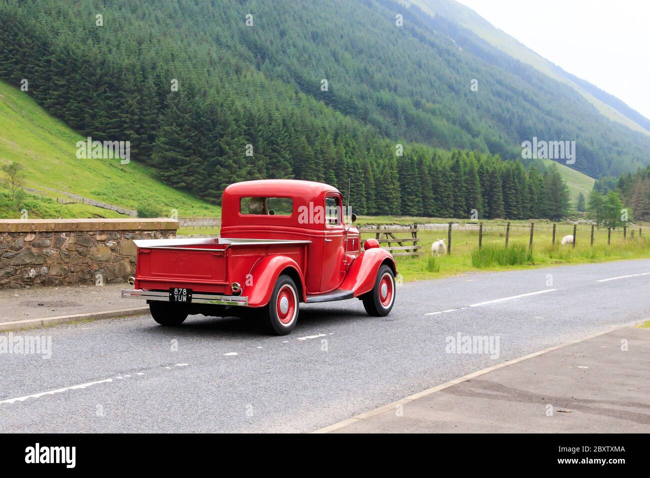 MOFFAT, SCOTLAND - JUNE 29, 2019: 1937 Ford V8 Deluxe pick up truck in a classic car rally en route towards the town of Moffat, Dumfries and Galloway Stock Photo