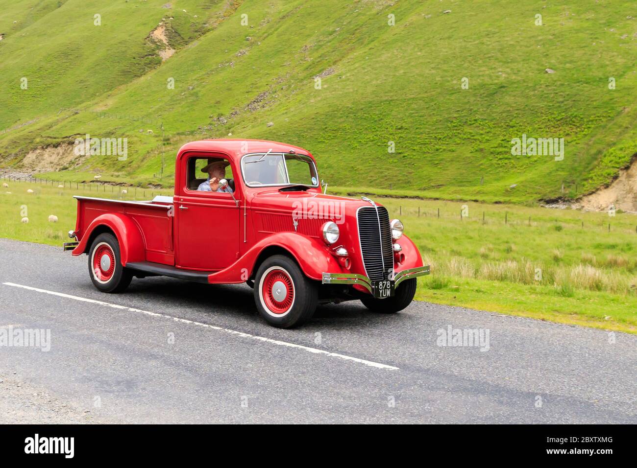 MOFFAT, SCOTLAND - JUNE 29, 2019: 1937 Ford V8 Deluxe pick up truck in a classic car rally en route towards the town of Moffat, Dumfries and Galloway Stock Photo