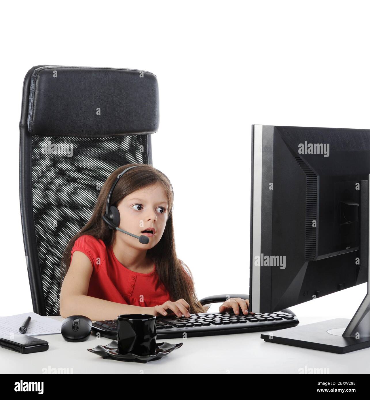 girl with astonishment looks in the computer Stock Photo