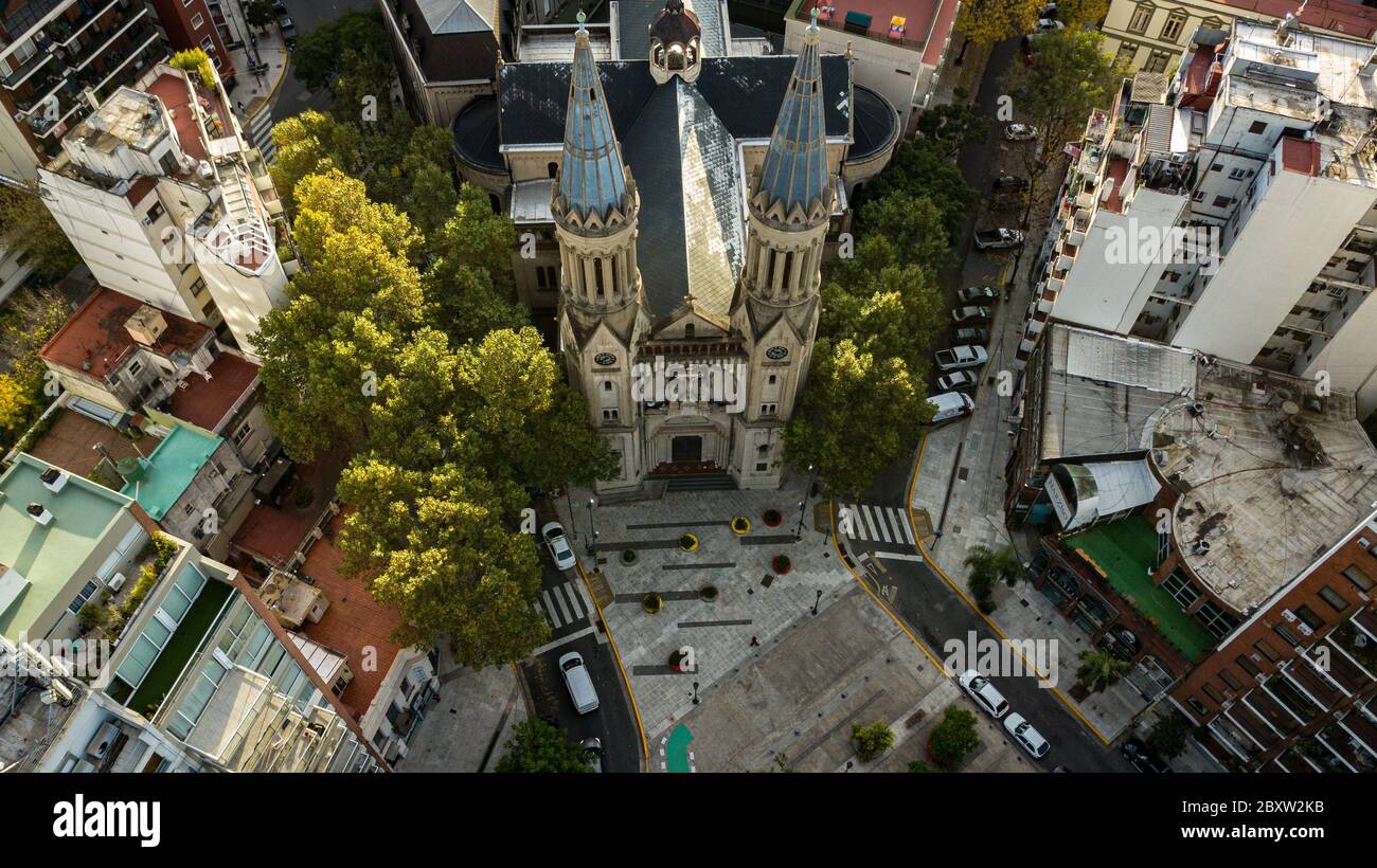 Aerial view of the catholic church in the residential area with apartments and common buildings in the neighbourhood. Stock Photo