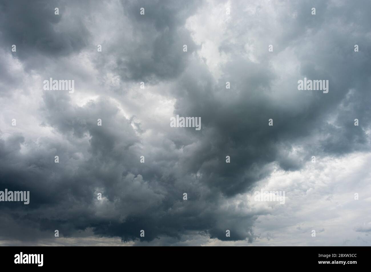 Dark storm clouds before rain used for climate background. Clouds become dark gray before raining. Abstract dramatic background Stock Photo