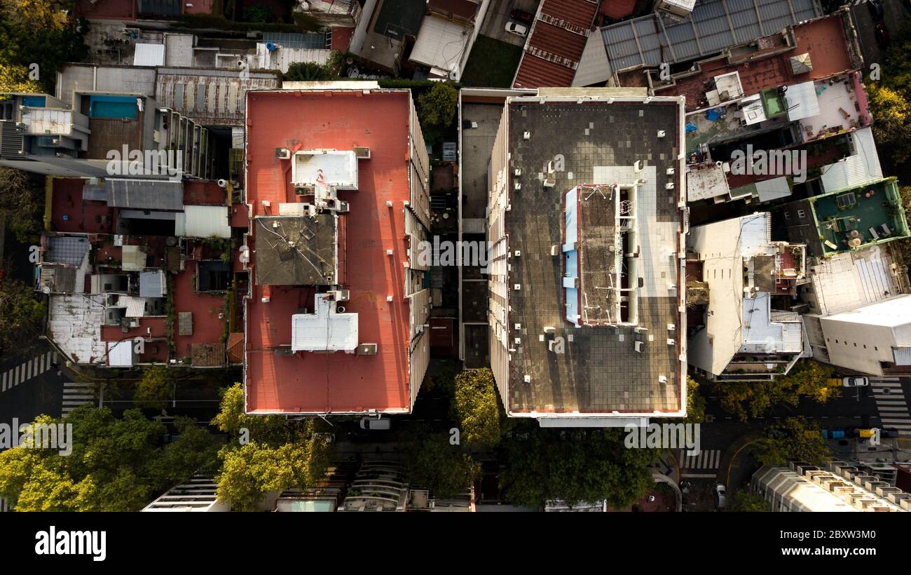 Aerial view of two tall apartment buildings next to each other really