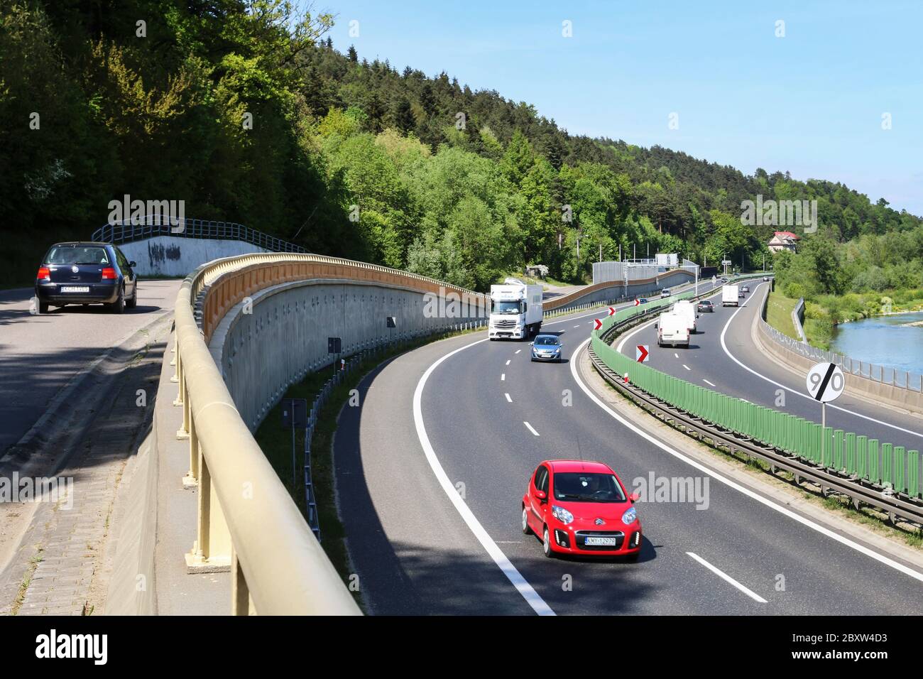 A multilane road passes through areas of high landscape value. Highway