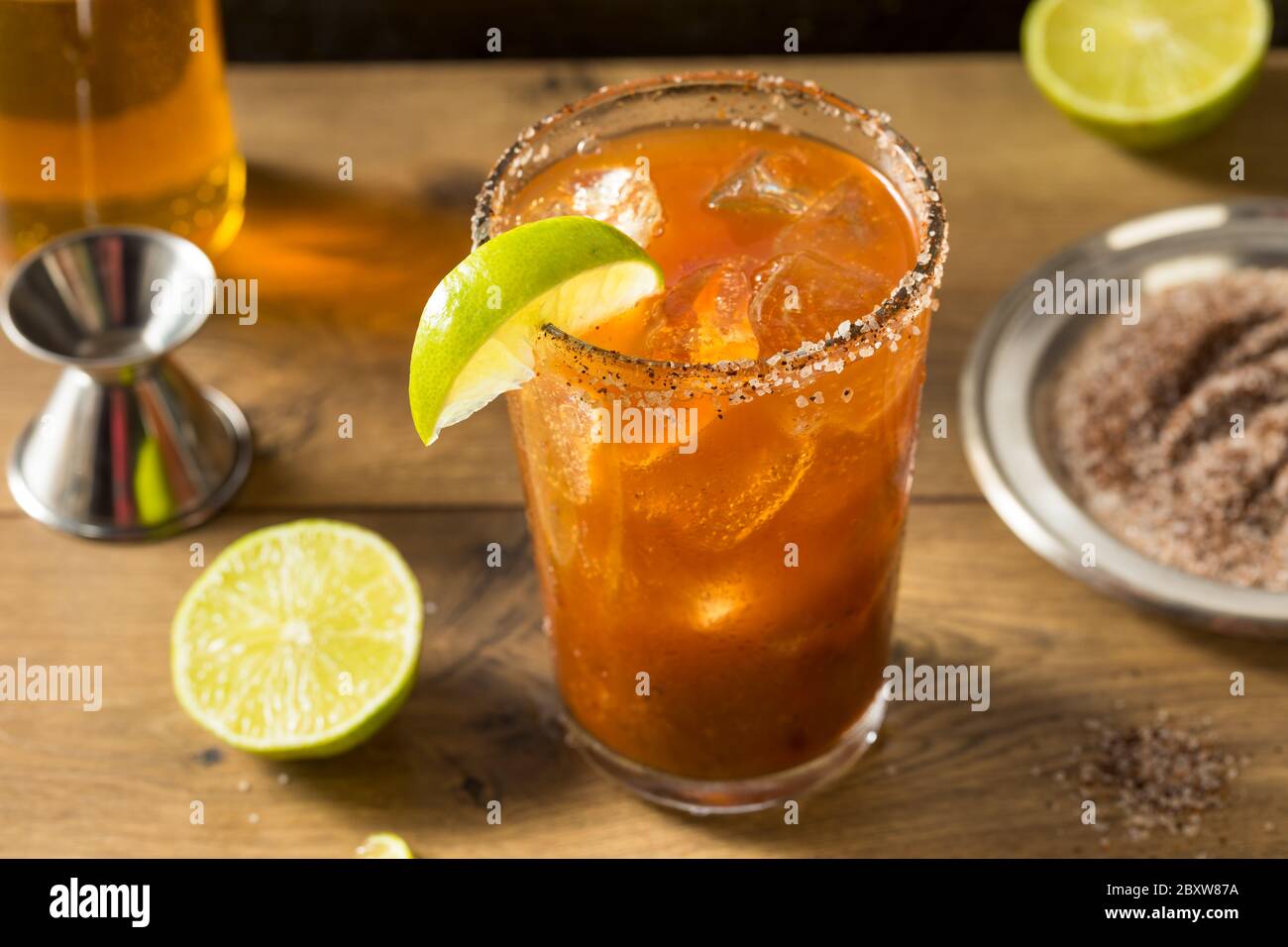 Homemade Mexican Michelada Beer Cocktail with Lime Stock Photo