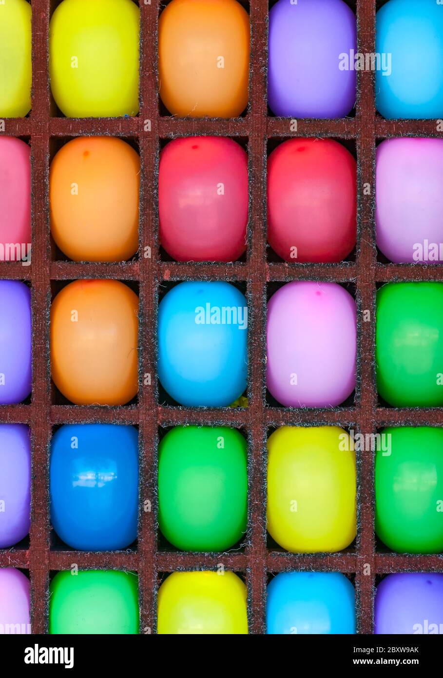 Bright multi-colored balloons in the cells Stock Photo