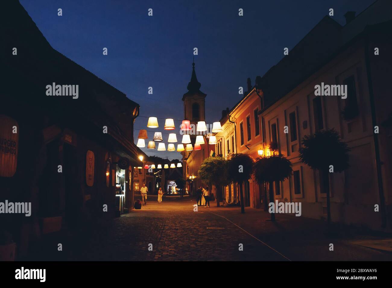 SZENTENDRE, HUNGARY - July 23, 2019 - Night view on the arty illuminated city centre of Szentendre, hungarian town full of artistic and souvenir shops Stock Photo