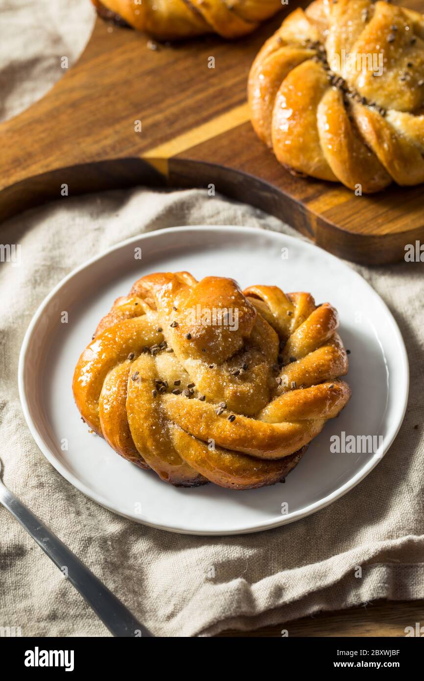 Sweet Homemade Swedish Cardamom Buns with Sugar for Breakfast Stock Photo