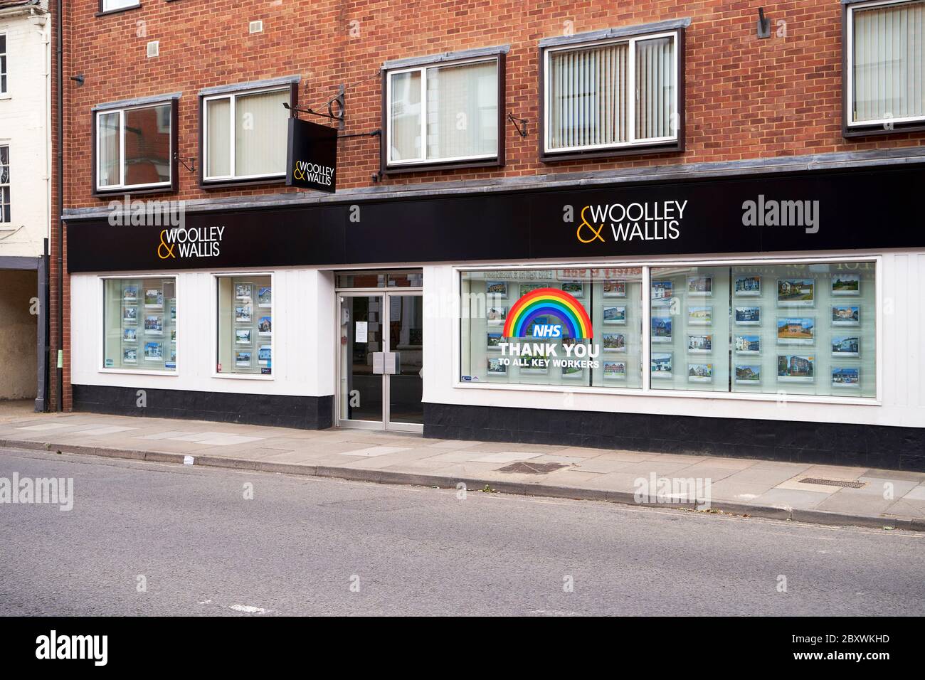 Estate Agents window displaying the NHS rainbow and thanking all key workers during the Coronavirus emergency Stock Photo
