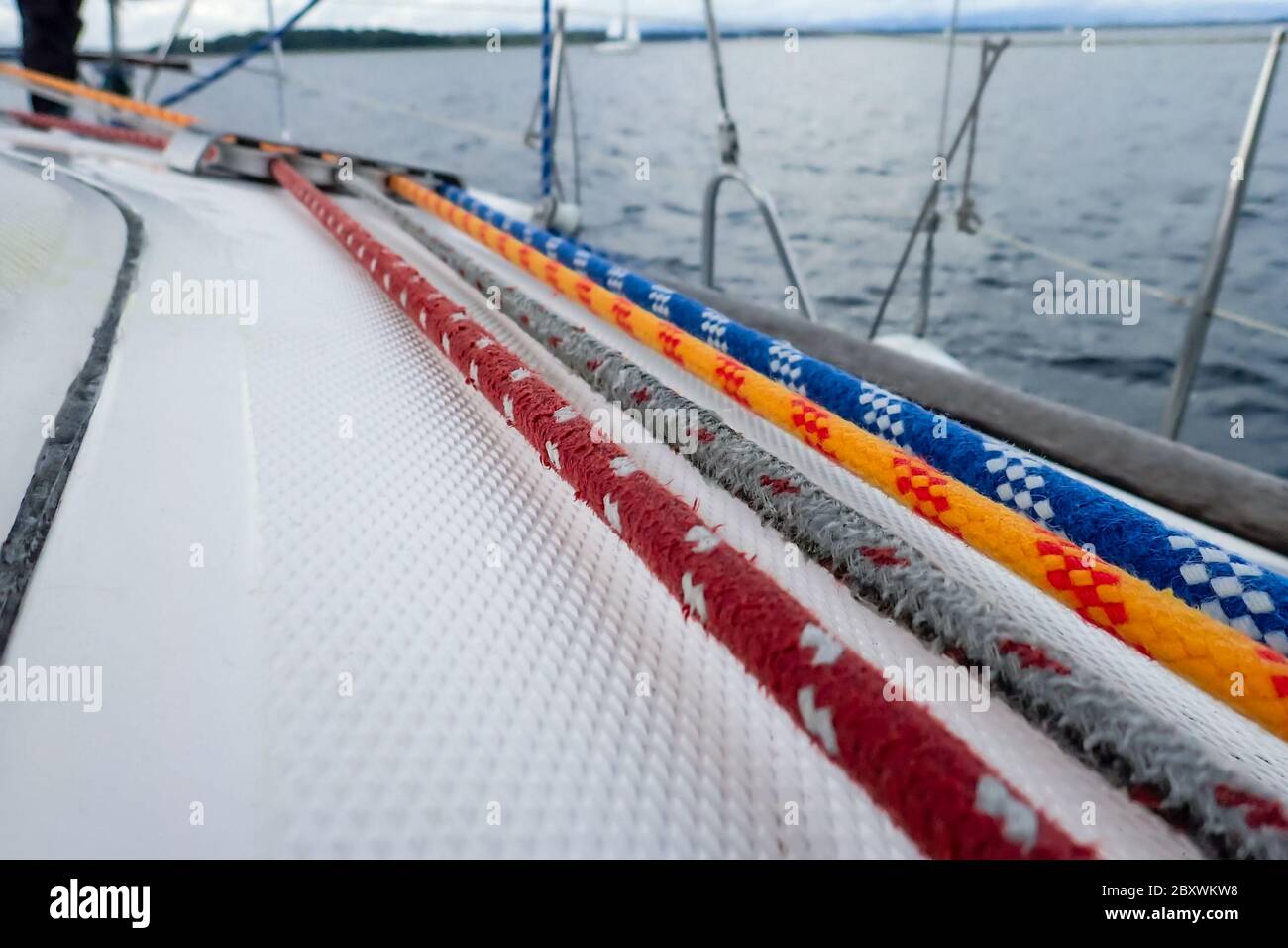 white yacht deck with colorful ropes Stock Photo