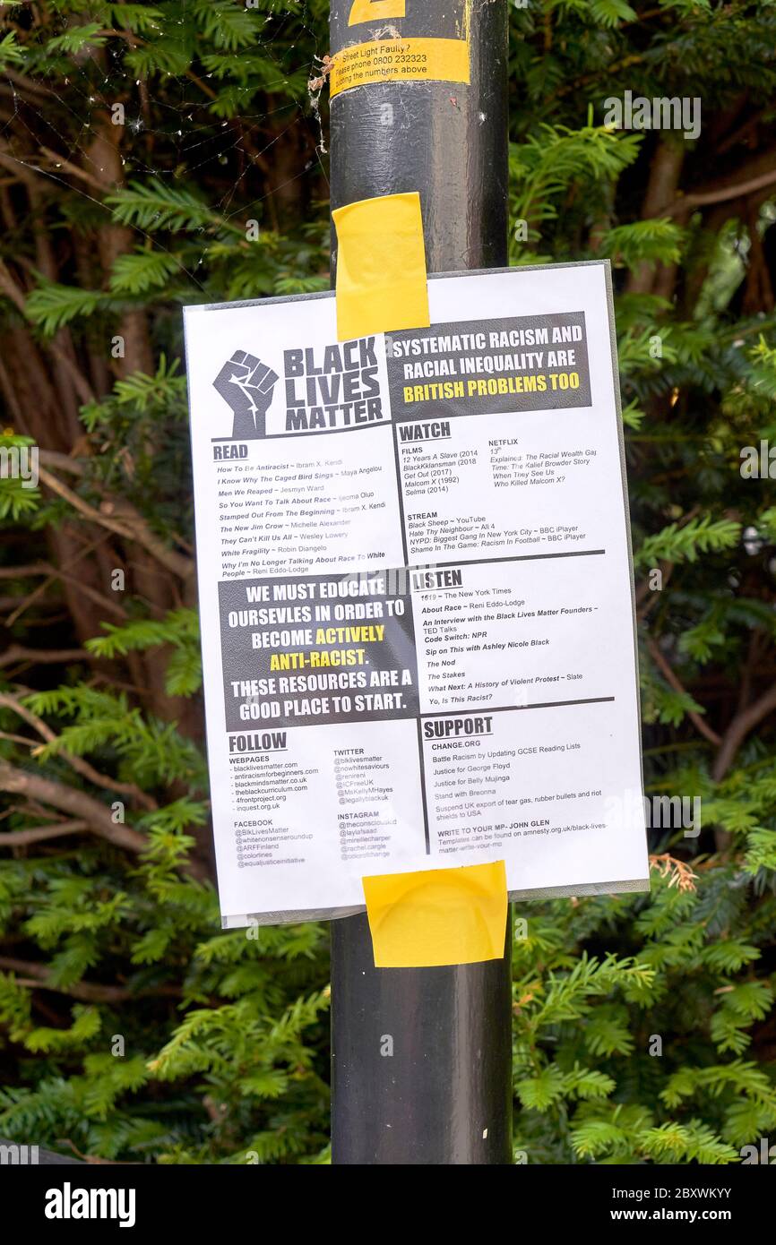 Black Lives Matter information flyer taped to a metal post Stock Photo