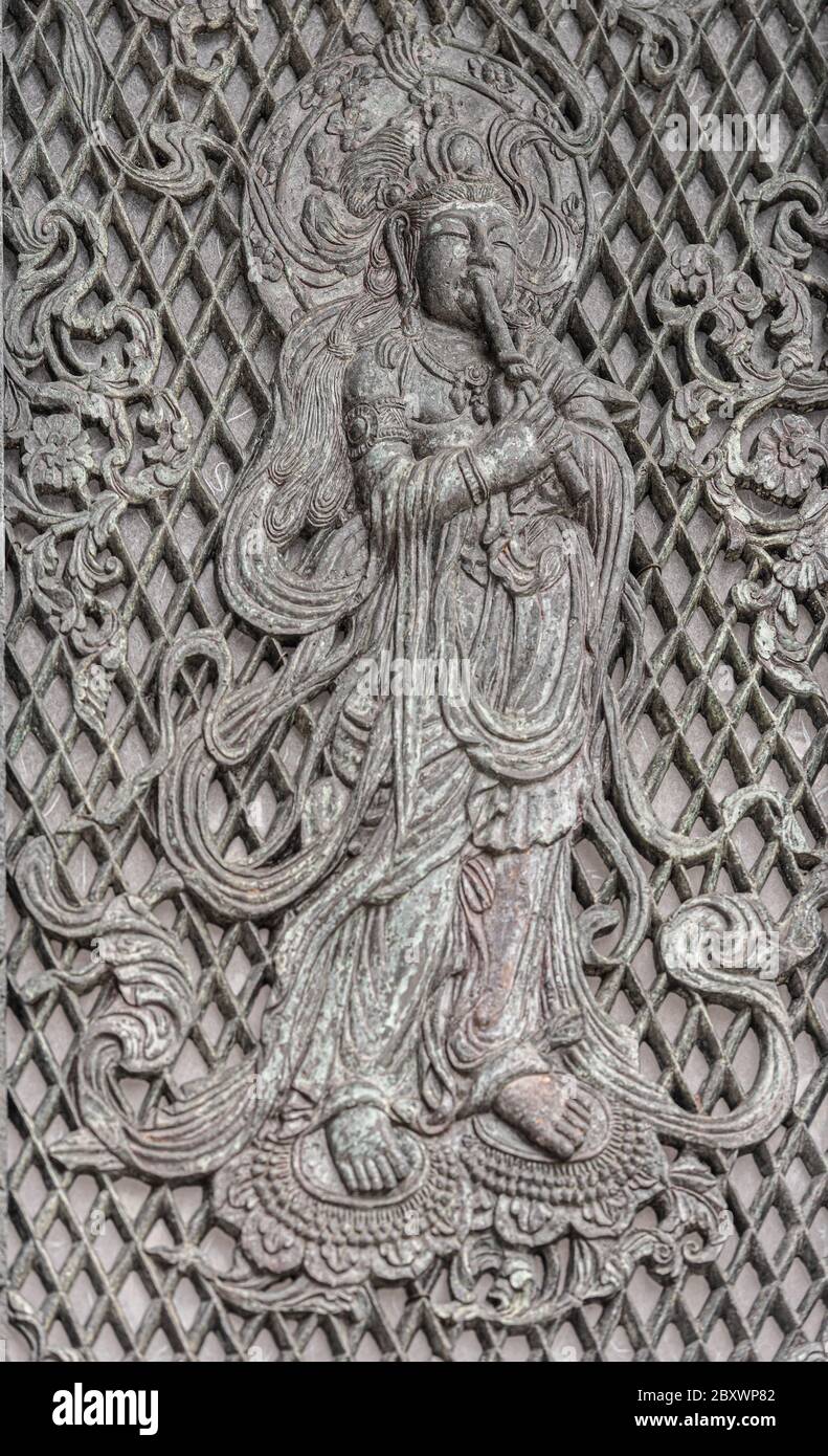 A detail of buddah. A relief on one of the Octagonal Lantern plates in front of the Great Buddha Hall, Tōdai-ji temple, Nara, Japan. Stock Photo