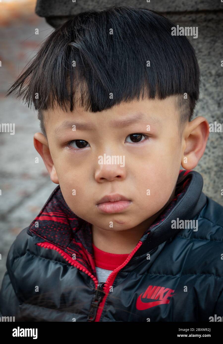 A young Japanese boy at the Kiyomizu Dera shrine. Not too happy, and just cried after his mother refusal to buy him candies.... Stock Photo