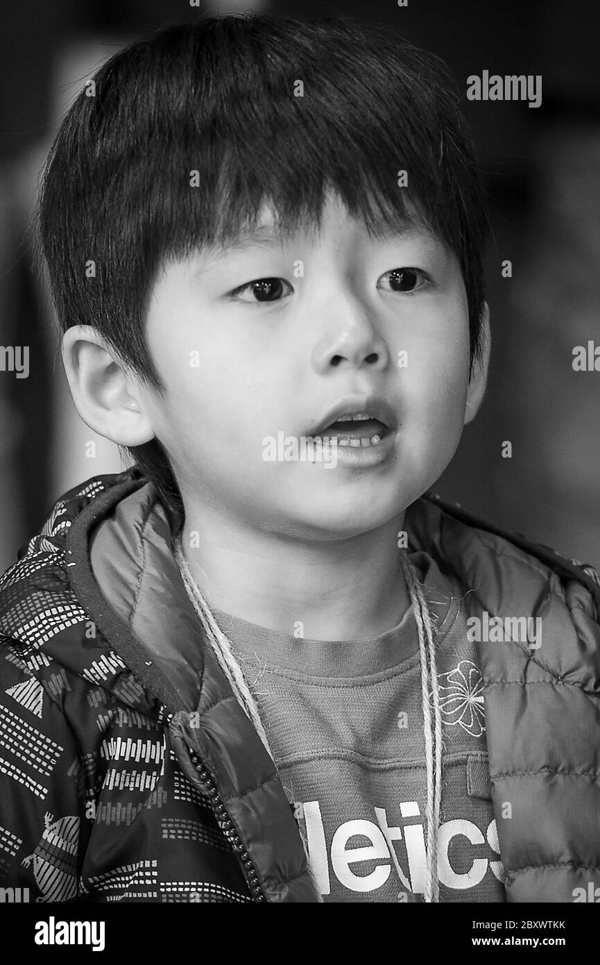 A Japanese boy portrait as he awaits the harvest festival at Meiji shrine in Tokyo, Japan Stock Photo