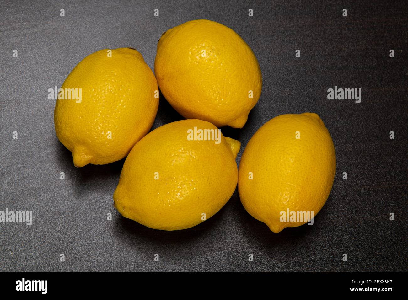 Lemon isolated on wooden background Stock Photo