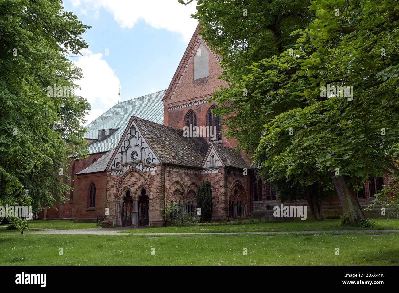 Narthex called paradise at the Luebeck cathedral built with open arcades in brick architecture, idyllically situated between old trees Stock Photo