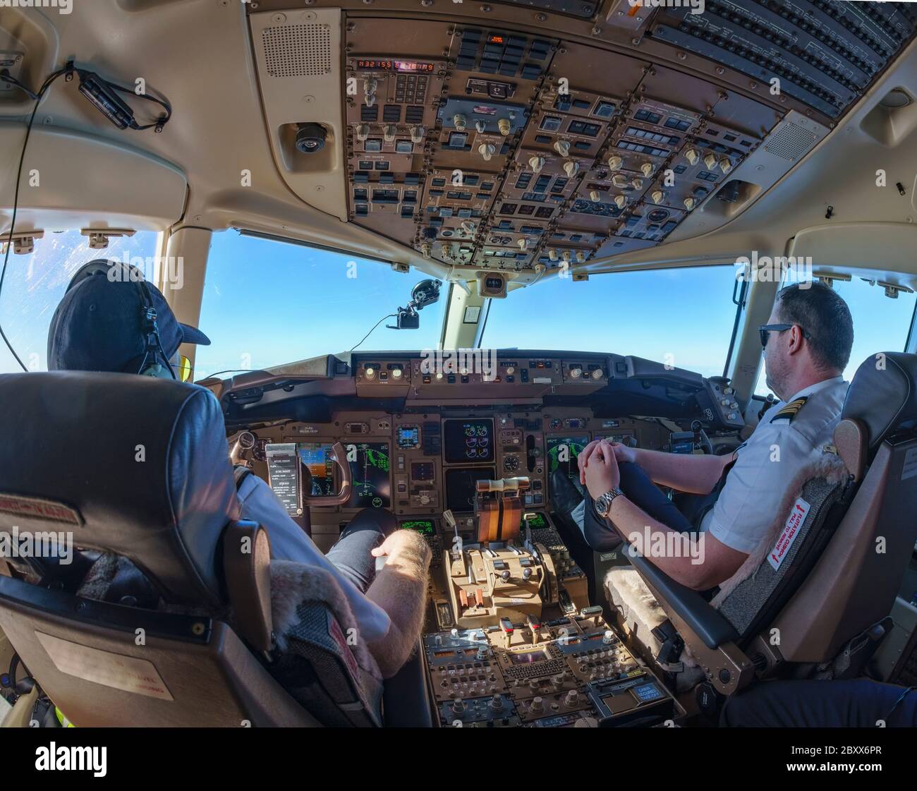 Cockpit view in Boeing 757-200 with pilot and co-pilot Stock Photo