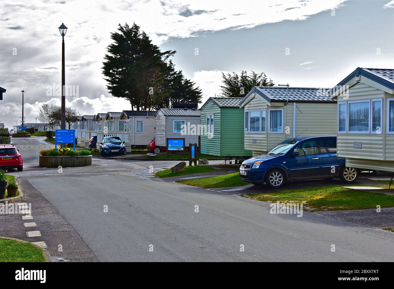 Cars parked outside holiday homes. The static caravans form part of the Trecco Bay Site, a