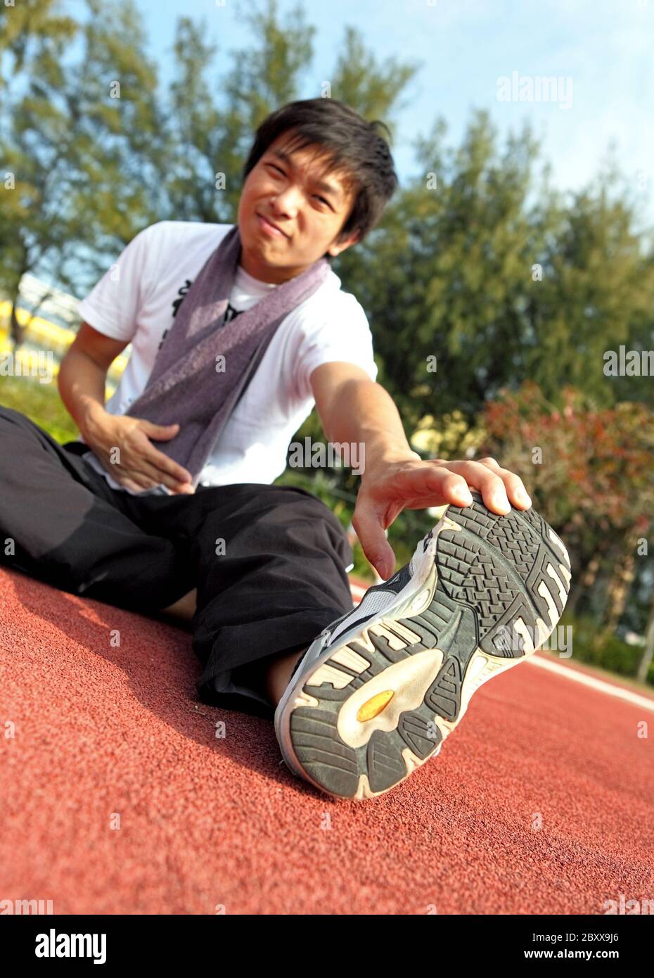 man doing stretching exercise Stock Photo