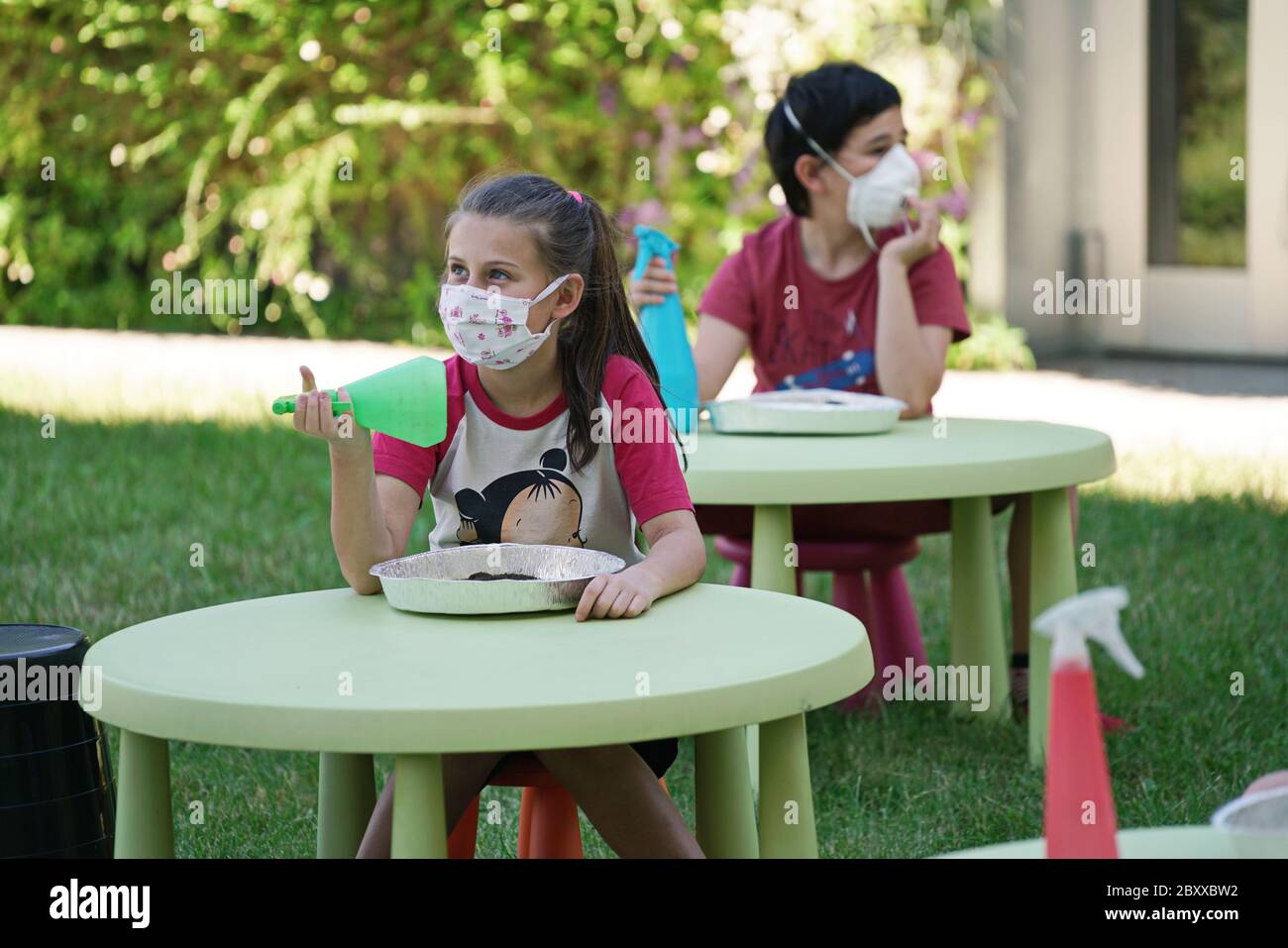 Coronavirus outbreak lifestyle:  outdoor summer school activities with social distancing measures. Turin, Italy - June 2020 Stock Photo