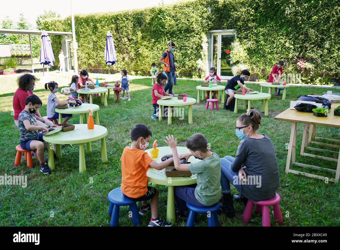 Coronavirus outbreak lifestyle:  outdoor summer school activities with social distancing measures. Turin, Italy - June 2020 Stock Photo