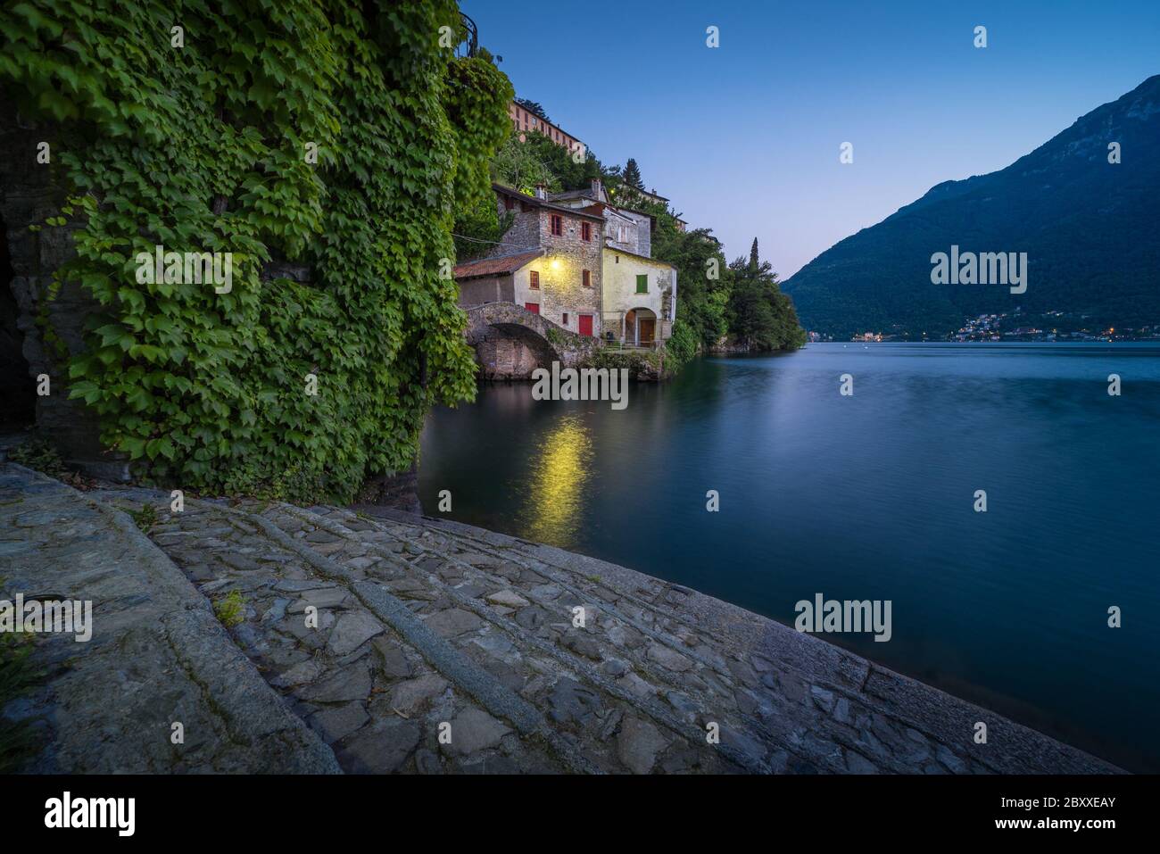 Scenic picture of Nesso on the Como lake in Italy with stone foreground