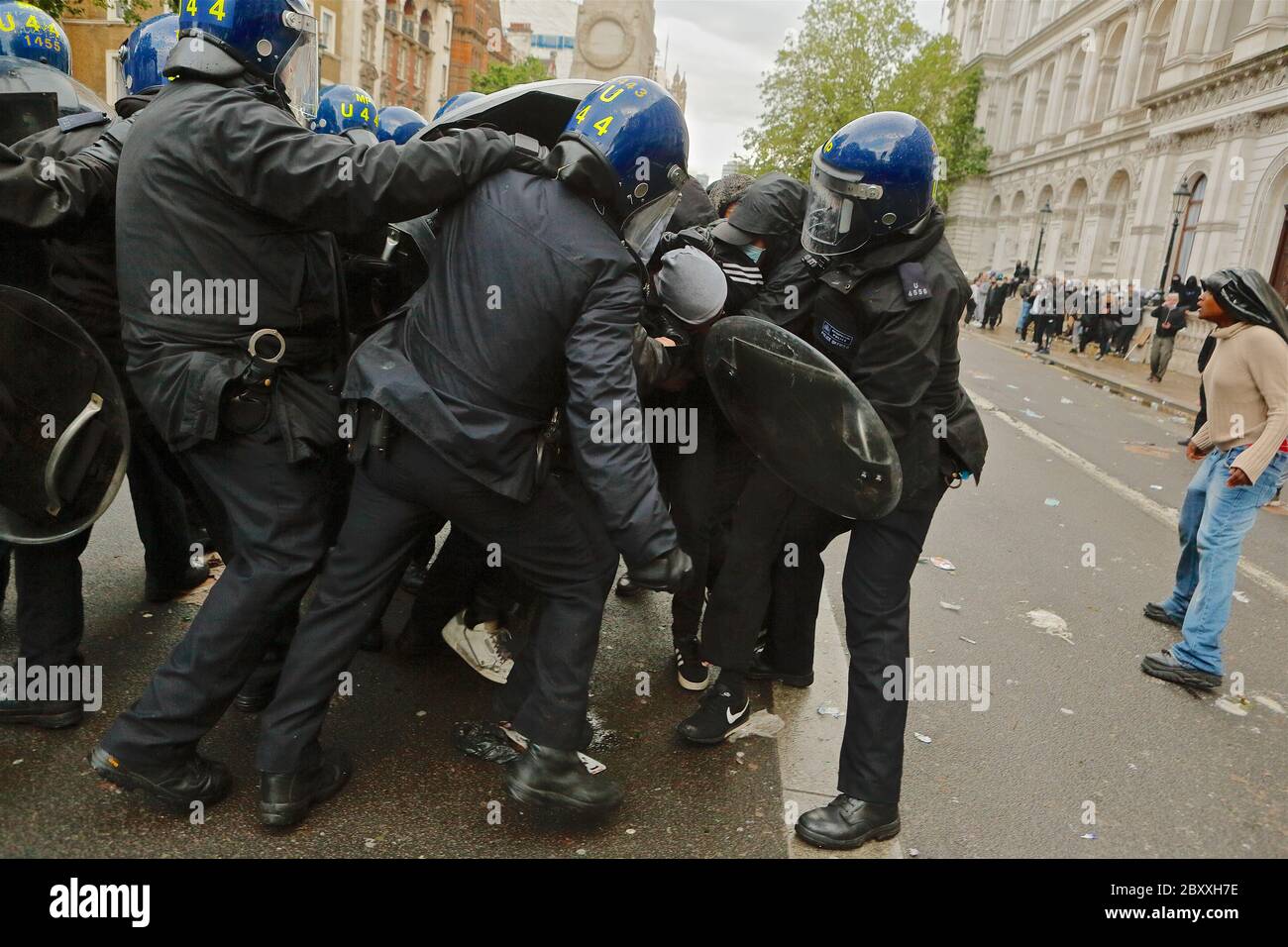 A protester is arrested amid violent skirmishes between police and anti racism protesters following America police killing of George Floyd. Stock Photo