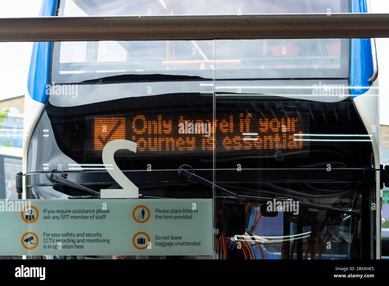 Only travel if your journey is essential sign on bus at SPT Buchanan Bus Station, Glasgow, Scotland, UK during the coronavirus lockdown Stock Photo