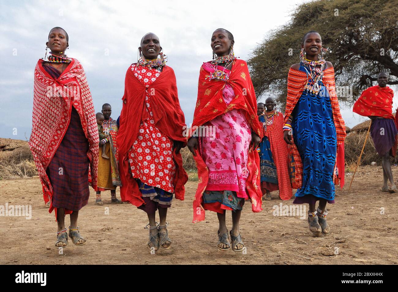 MASAI MARA, KENYA – AUGUST 23: Group of unidentified African women from Masai tribe show a traditional Jump dance on August 23, 2010 in a local villag Stock Photo