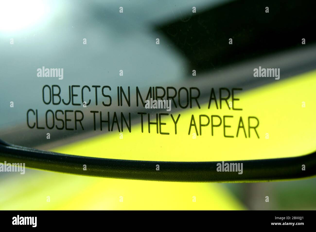 Objects in mirror are closer then they appear Stock Photo Alamy