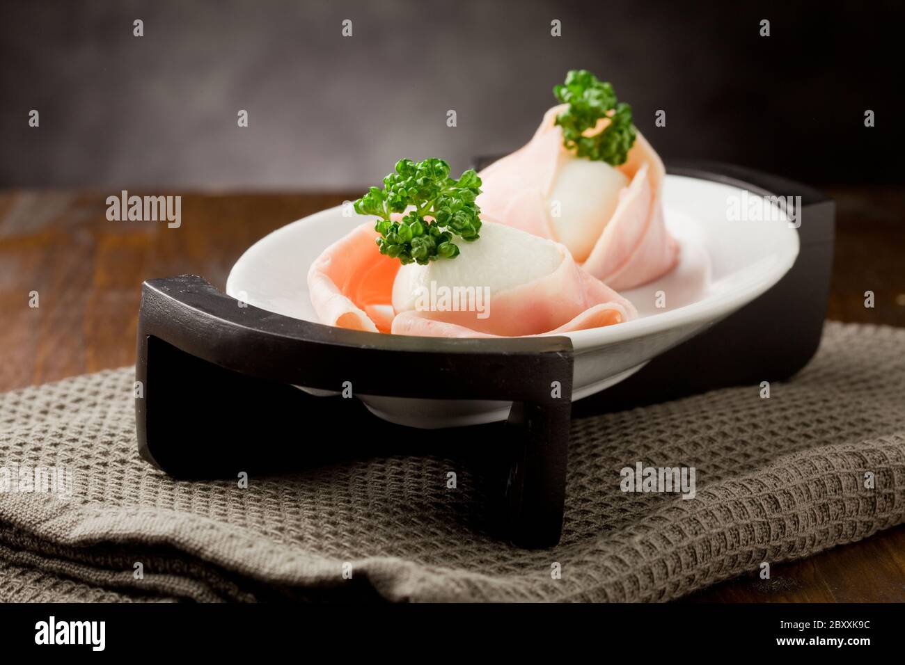 Mozzarella with wrapped ham Stock Photo Alamy