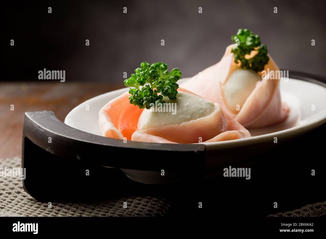 Mozzarella with wrapped ham Stock Photo Alamy