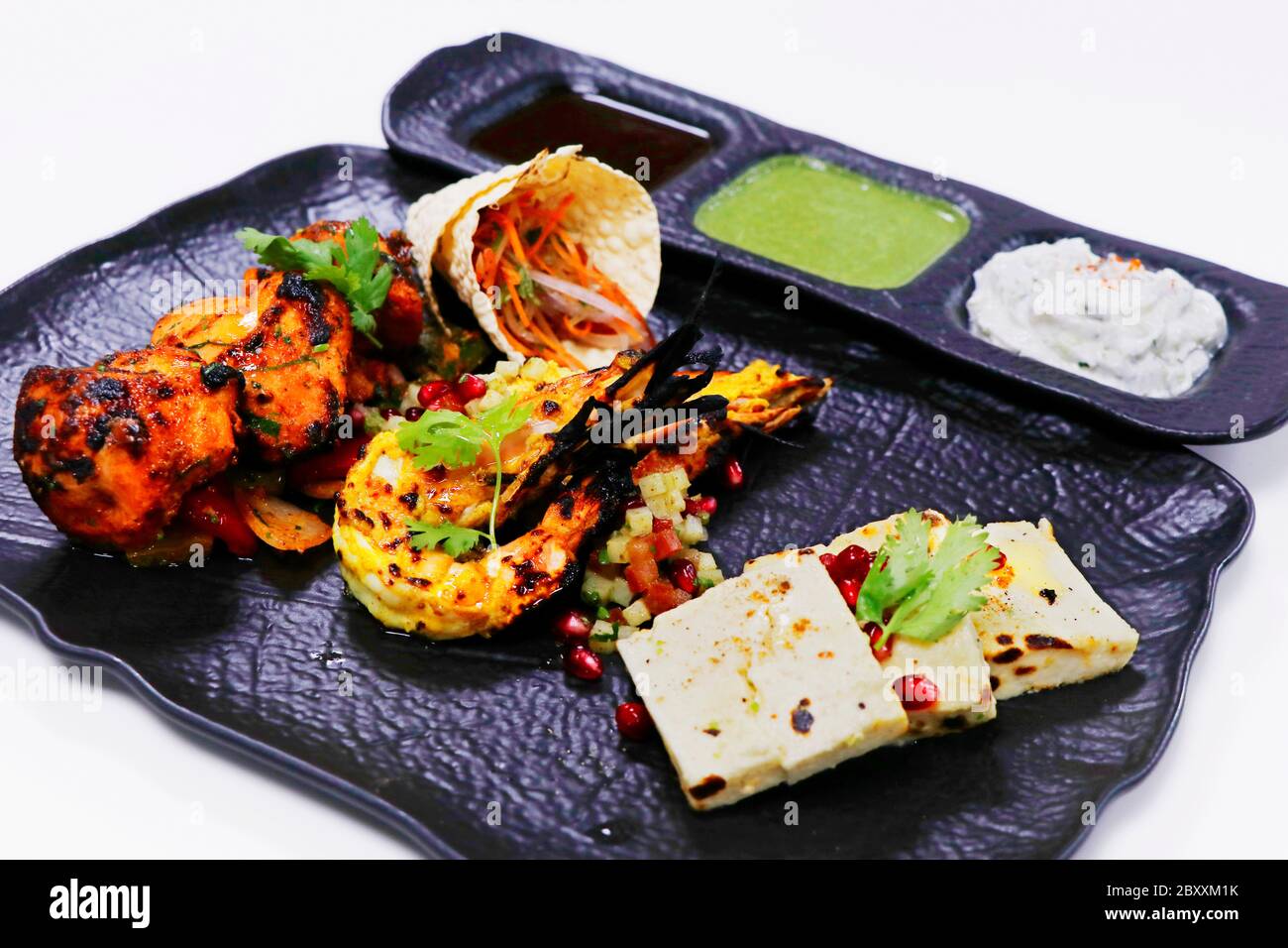 tandoori platter with chicken tikka, grilled prawns, and paneer along