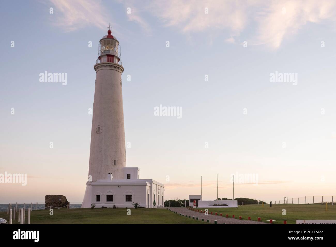 Lighthouse of Cabo de Santa Maria, an Uruguayan emblematic building declared National Historic Monument, located in La Paloma, Rocha, Uruguay. Sunset Stock Photo