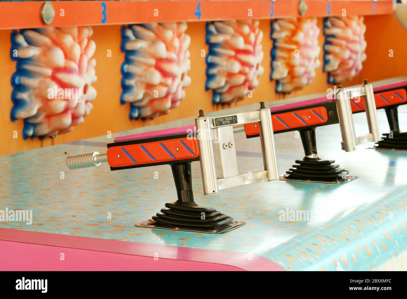 A Amusement park squirt gun water game Stock Photo