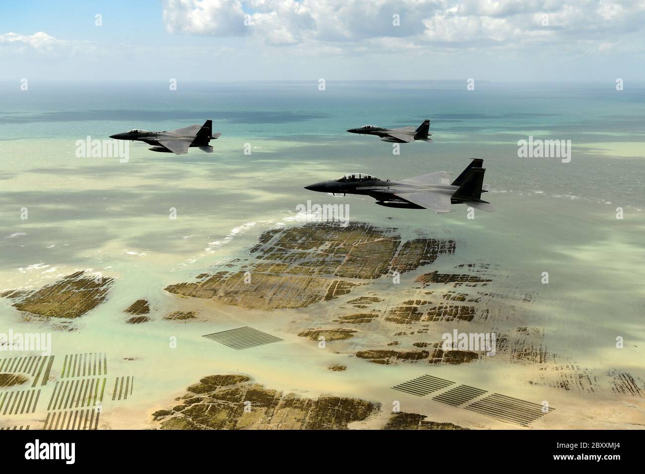 U.S. Air Force F-15 Eagle fighter aircraft, assigned to the 48th Fighter Wing conduct a flypast over the beaches and battle sites to mark the 76th anniversary of D-Day June 6, 2020 in Normandy, France. Stock Photo
