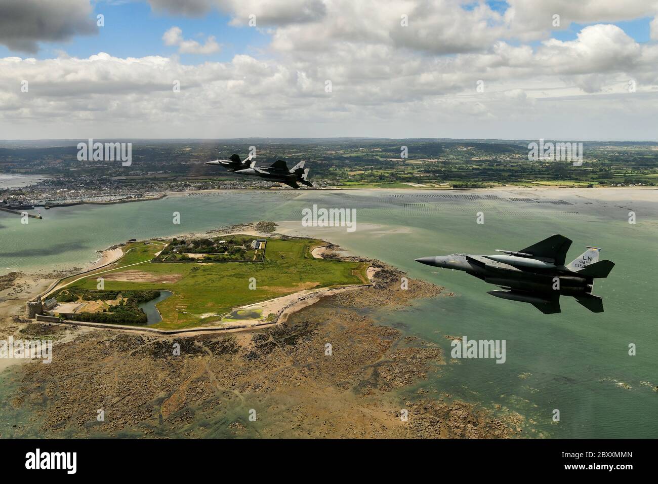 U.S. Air Force F-15 Eagle fighter aircraft, assigned to the 48th Fighter Wing conduct a flypast over the beaches and battle sites to mark the 76th anniversary of D-Day June 6, 2020 in Normandy, France. Stock Photo