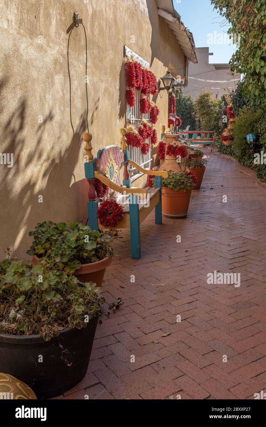 brick lined street with hanging red chiles in Old Town Albuquerque, New Mexico Stock Photo